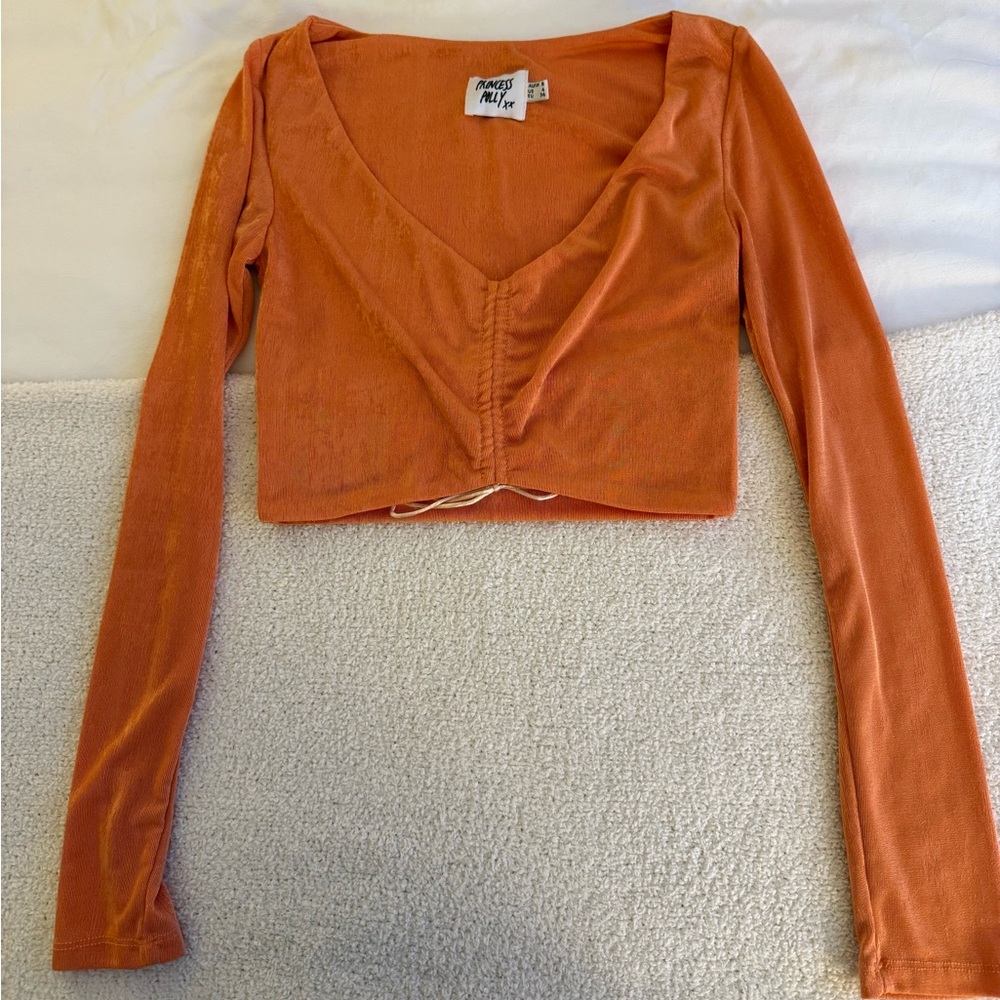 Orange Long Sleeve Crop Top.